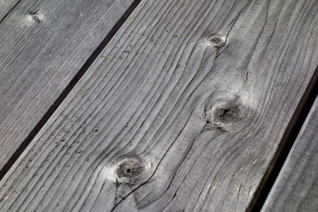 Weatherworn planks on top of wooden table photo