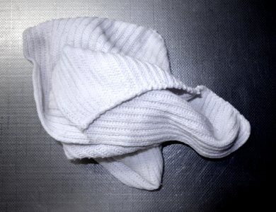 White dishcloth on a stainless steel kitchen sink 1