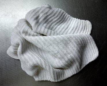 White dishcloth on a stainless steel kitchen sink 2