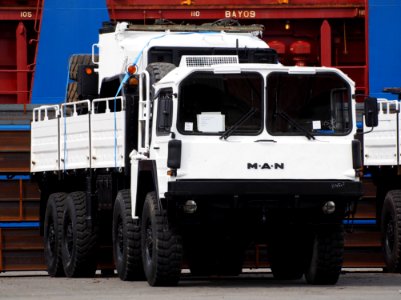 White MAN truck in Port of Antwerp ready for shipping photo
