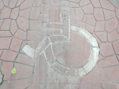 Wheelchair accessibility signs on ground