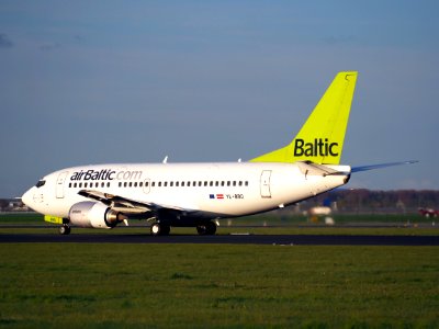 YL-BBQ Air Baltic Boeing 737-522 - cn 26691 takeoff from Polderbaan, Schiphol (AMS - EHAM) at sunset, pic2 photo