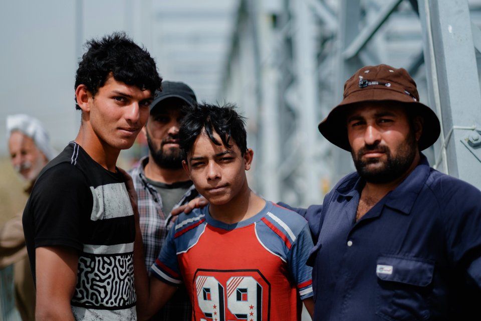 Young men gathered at Mosul's "Old Bridge" over the Tigris River in summer of 2019 to jump into the water and escape summer heat 26