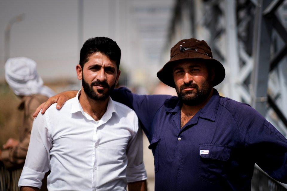 Young men gathered at Mosul's "Old Bridge" over the Tigris River in summer of 2019 to jump into the water and escape summer heat 24