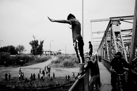 Young men gathered at Mosul's "Old Bridge" over the Tigris River in summer of 2019 to jump into the water and escape summer heat 02