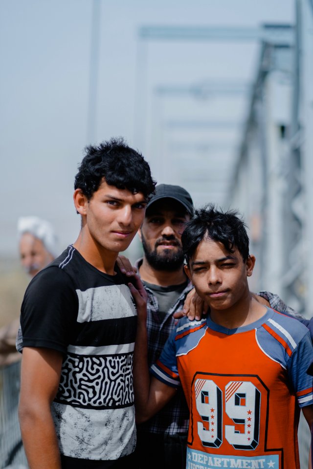 Young men gathered at Mosul's "Old Bridge" over the Tigris River in summer of 2019 to jump into the water and escape summer heat 25
