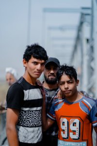 Young men gathered at Mosul's "Old Bridge" over the Tigris River in summer of 2019 to jump into the water and escape summer heat 25
