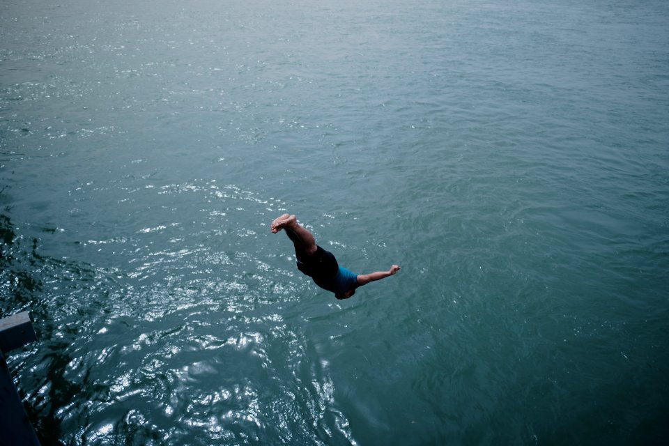 Young men gathered at Mosul's "Old Bridge" over the Tigris River in summer of 2019 to jump into the water and escape summer heat 16