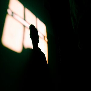 Silhouette man black room photo