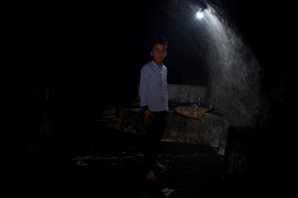 Young boy standing next to the shrine of Obakr at Lalish 10