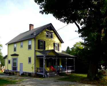 Yellow house in Oldwick New Jersey with tree