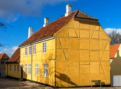 Yellow timber frammed house Roskilde cathedral square Denmark photo