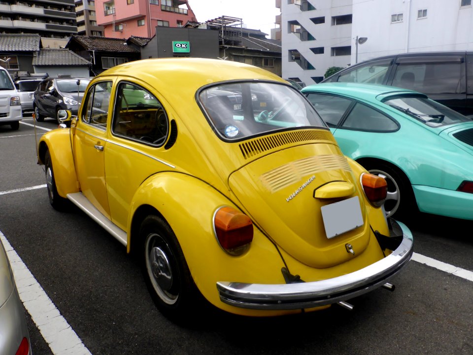 Yellow VolksWagen TYPE 1 rear