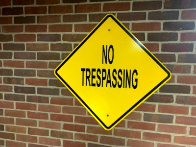 Yellow No Trespassing Sign photo