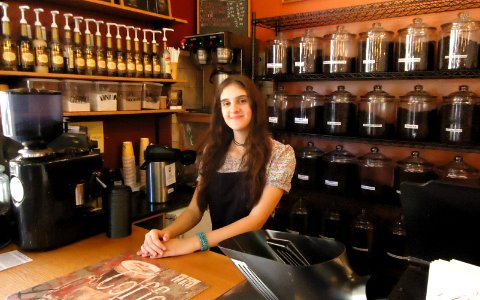 Woman at counter at Ahrres Coffee Roastery in Summit NJ