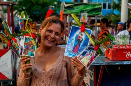 Woman Seller sacred palm photo
