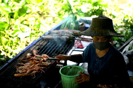 Woman selling foods at Taling Chan market