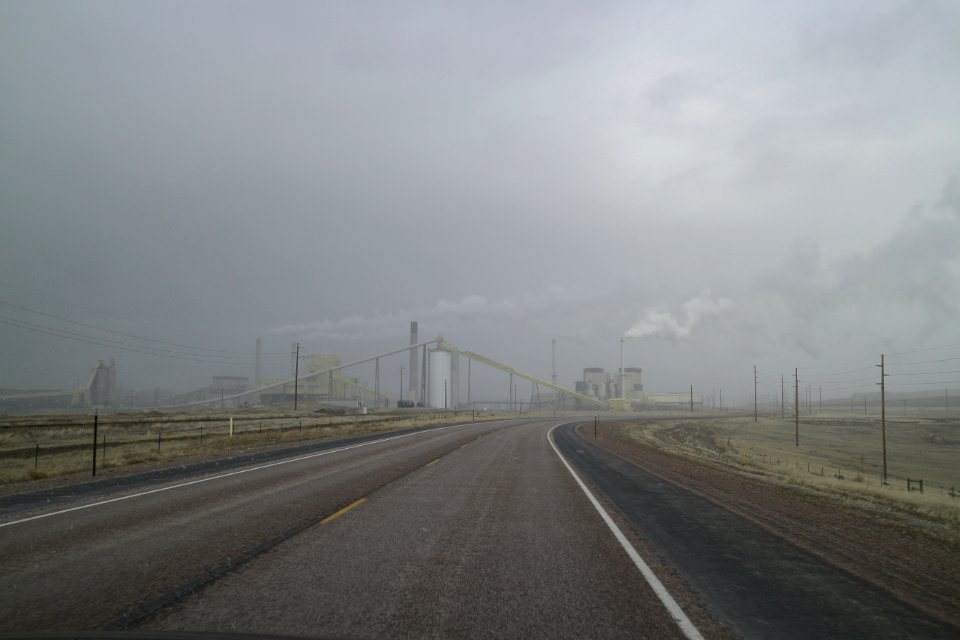 Wyoming Highway 51 going east during a snow storm with the Wyodak Power Plant visible