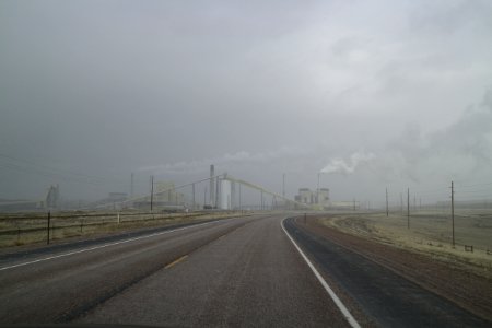 Wyoming Highway 51 going east during a snow storm with the Wyodak Power Plant visible