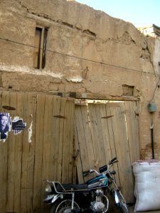 Wooden door and Motorcycle in the Bazaar of Nishapur 2