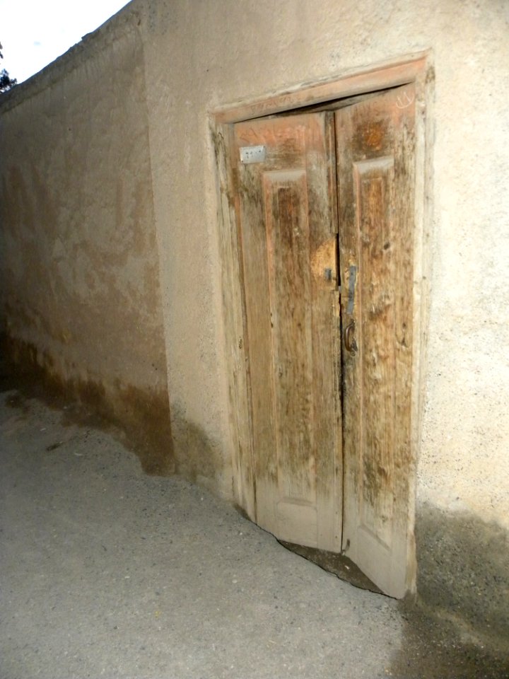 Wooden door of an old house in nishapur 7