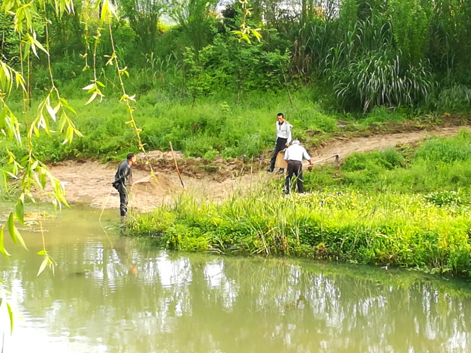 Workers are digging sand in the Chujiang River, 24 April 2019