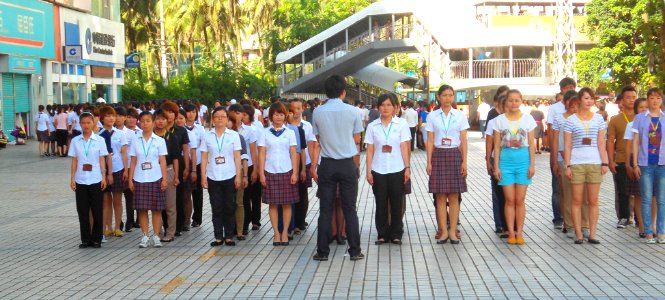 Workers standing in formation in China
