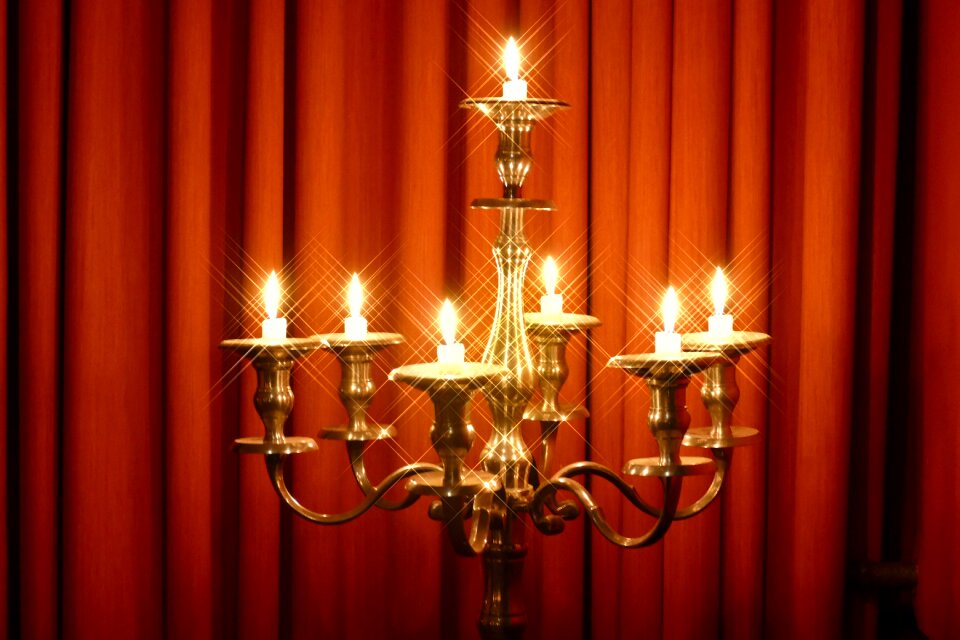 Candlestick ornament illuminated