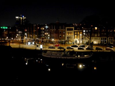 Amsterdam by night in snow evening - at the street Kattenburgergracht photo