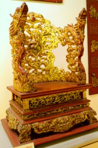 Altar in the shape of a chair, Nguyen dynasty, 19th to early 20th century, crimson and gilded wood, view 2 - National Museum of Vietnamese History - Hanoi, Vietnam - DSC05626 photo