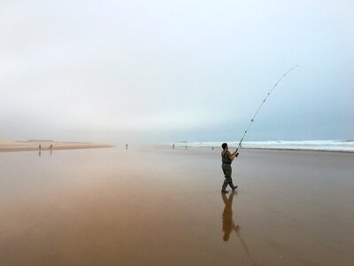 Fishing rod beach morocco photo