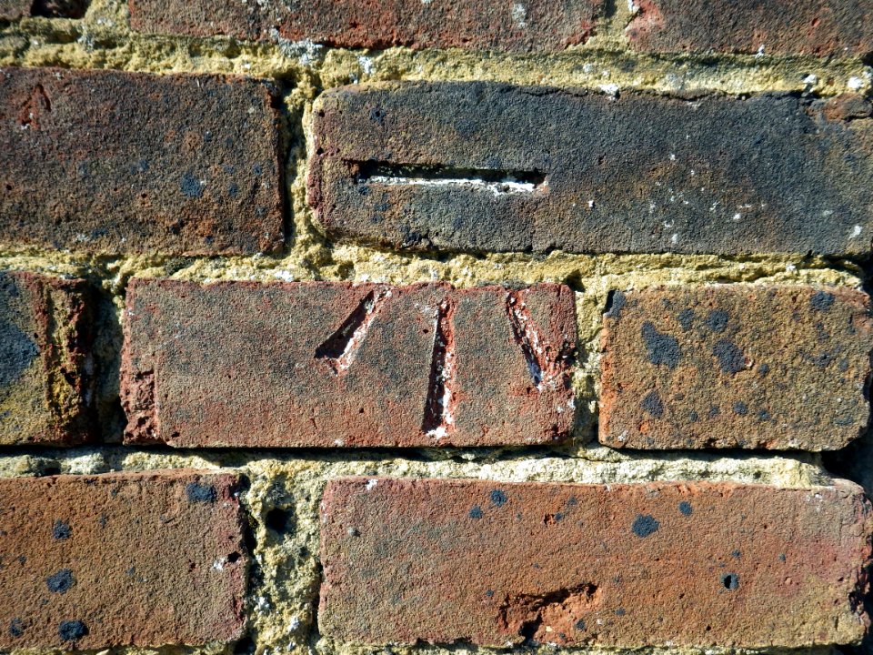 Benchmark, Wall, 133-135 Pebsham Lane, Bexhill
