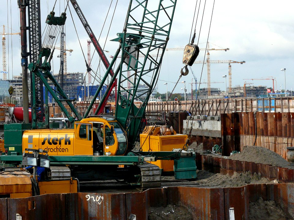 Building cranes and earthworks between Amsterdam Central Station and the waterfront of the IJ, 2006