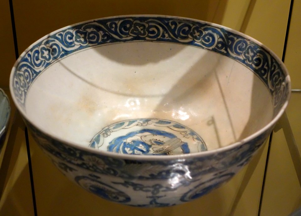 Bowl with curled dragons in medallions, based on a late 16th century Chinese model, five character-marks on base, view 1, Iran, Kirman, mid 1600s, underglaze-painted stonepaste - Royal Ontario Museum - DSC04793