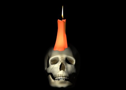 Skull and crossbones candlelight background photo