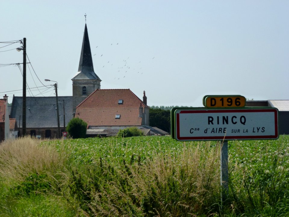Aire-sur-la-Lys (Pas-de-Calais, Fr) church and city limit sign Rincq
