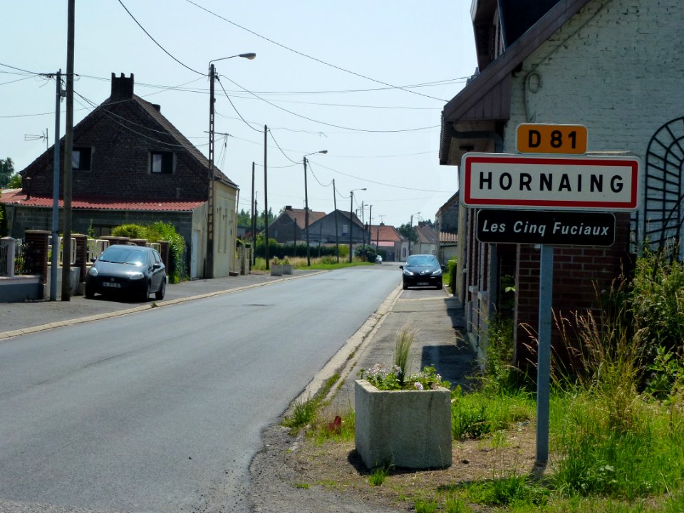 Hornaing (Nord, Fr) city limit sign Les cinq Fuciaux