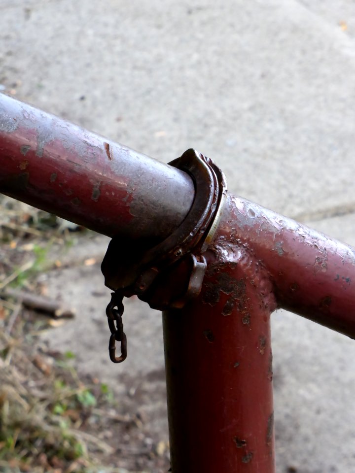 Handcuffs-on-rusty-handrail