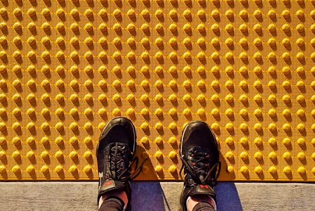 Yellow tactile paving curb photo