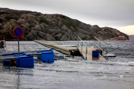 Jetty floating above the quay in Valbodalen harbor during Storm Ciara photo