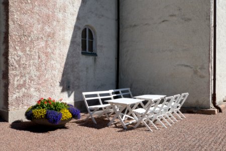 Corner of Bro Church, Lysekil with chiars and tables