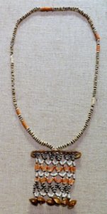 Disk necklace, Langu Langu Lagoon, Lau Lassi Village, Malaita Isle, Solomon Islands, 1900-1945, shell, coral, seed pod - Spurlock Museum, UIUC - DDSC06000