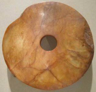 Disk('bi) from China, Shang dynasty, c. 1500 BCE, nephrite, Honolulu Academy of Arts