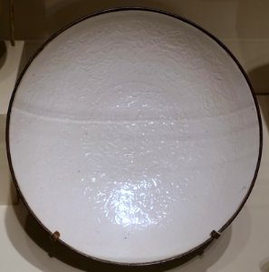 Dish with molded lotus, squared spiral, and peony designs, Ding ware, China, Hebei province, Dingzhou, Jin dynasty, 1100s-1200s AD, glazed porcelain, metal - Portland Art Museum - Portland, Oregon - DSC08414