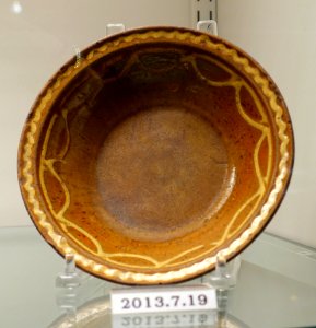Dish, United States, Pennsylvania or Maryland, 1840-1860, lead-glazed redware with white slip, item HD 2013.7.19 - Flynt Center of Early New England Life - Deerfield, Massachusetts - DSC04050