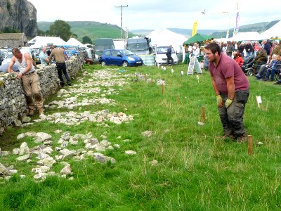 Dry stone wall building 08 photo