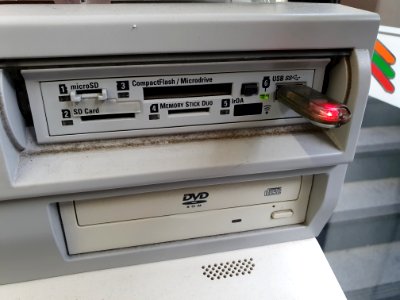 Media insertion interface for printing at Japanese convenience store