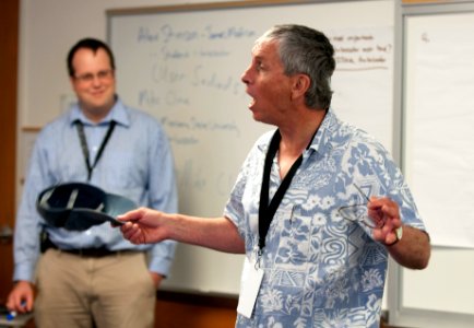 Mike Cline speaking at his event with hat off