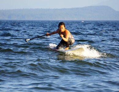 Surfing paddle sport photo
