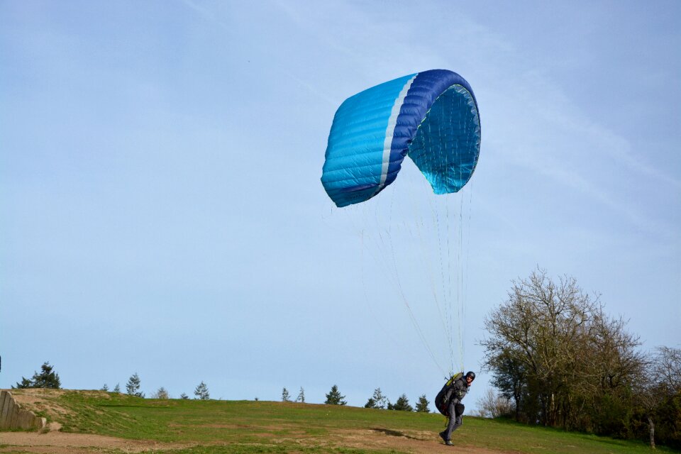 Paramotor sailing blue to lash the wind